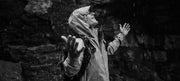 Model wearing a Finisterre waterproof jacket in the rain