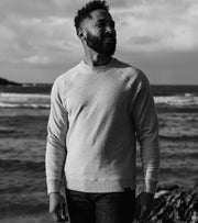 Model wearing a Finisterre organic cotton sweatshirt