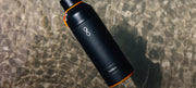 Ocean bottle floating on shallow water
