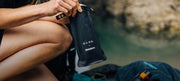 DAME bag being held on beach
