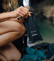 DAME bag being held on beach